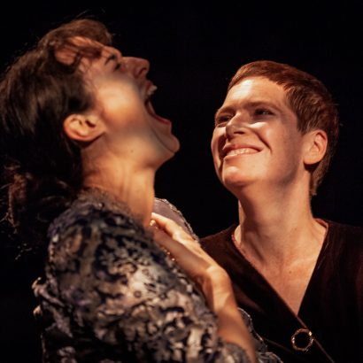 Evalyn Parry and Anna Chatterton laughing together onstage in the play Gertrude and Alice.